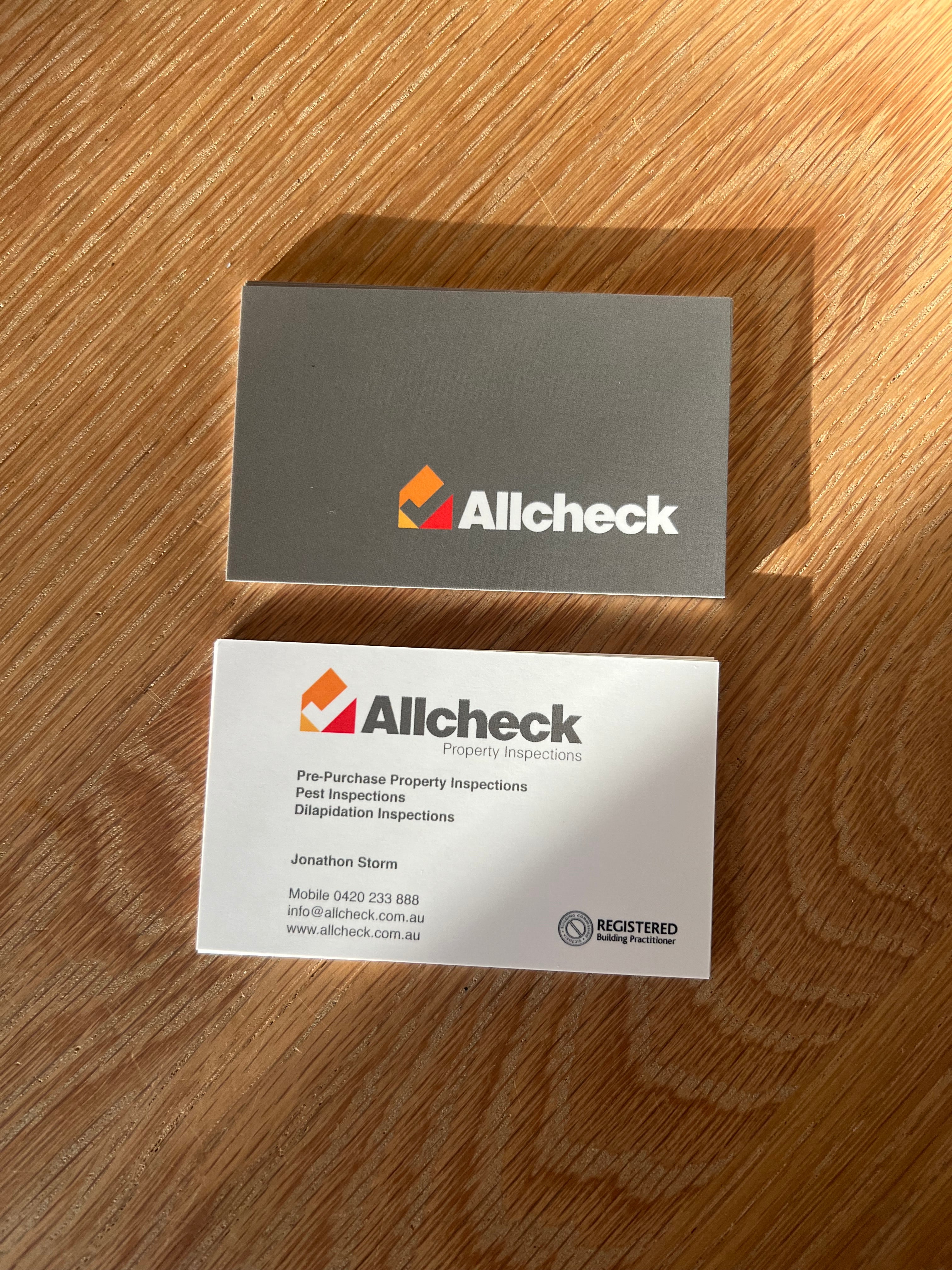 Allcheck_Property_Inspections_Business_Cards_By_Saltwater_Sign_Co._in_sunlight.jpg