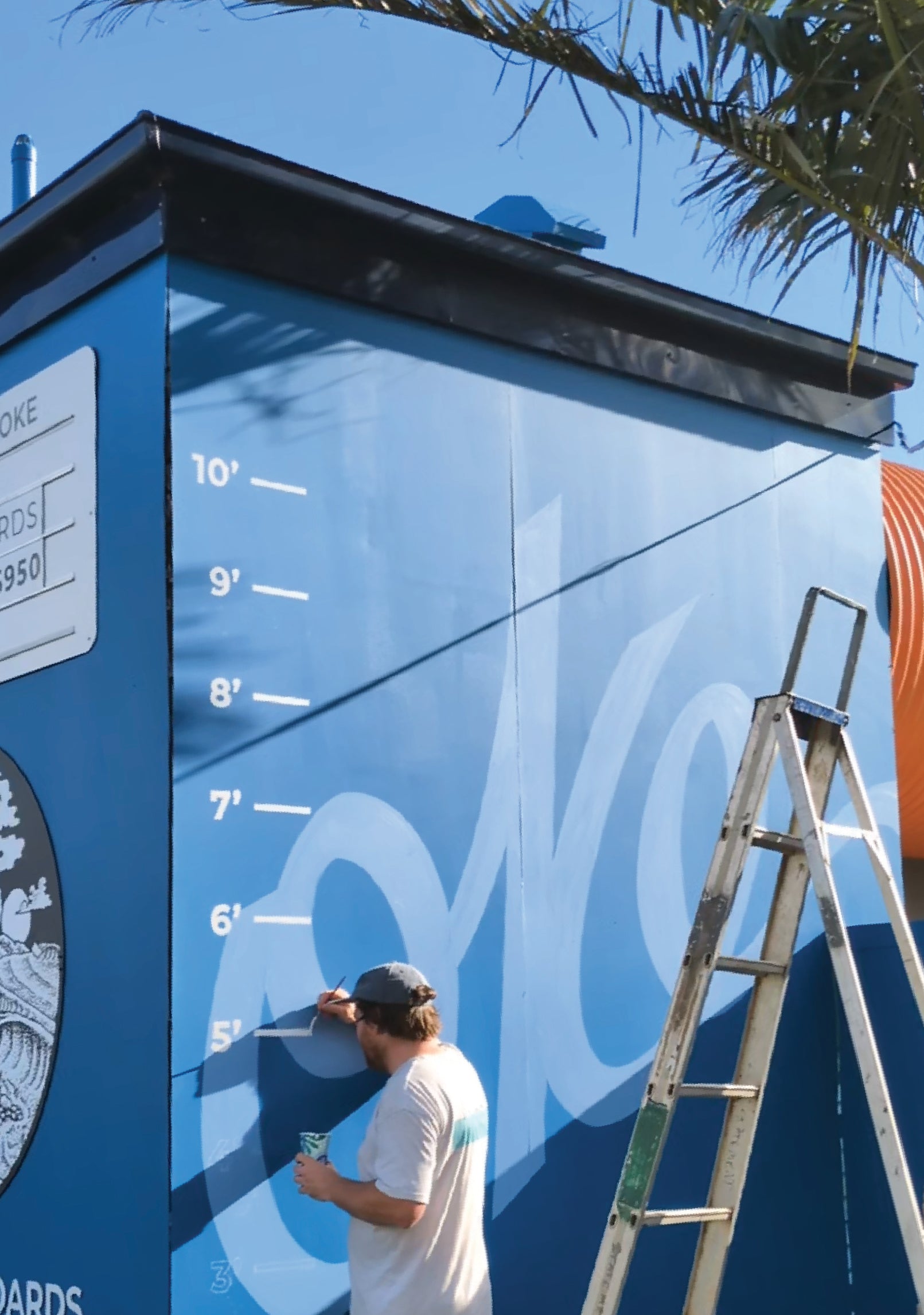 Mark using Traditional Brushwork to paint wall for Oke Surfboards by Saltwater Sign Co.