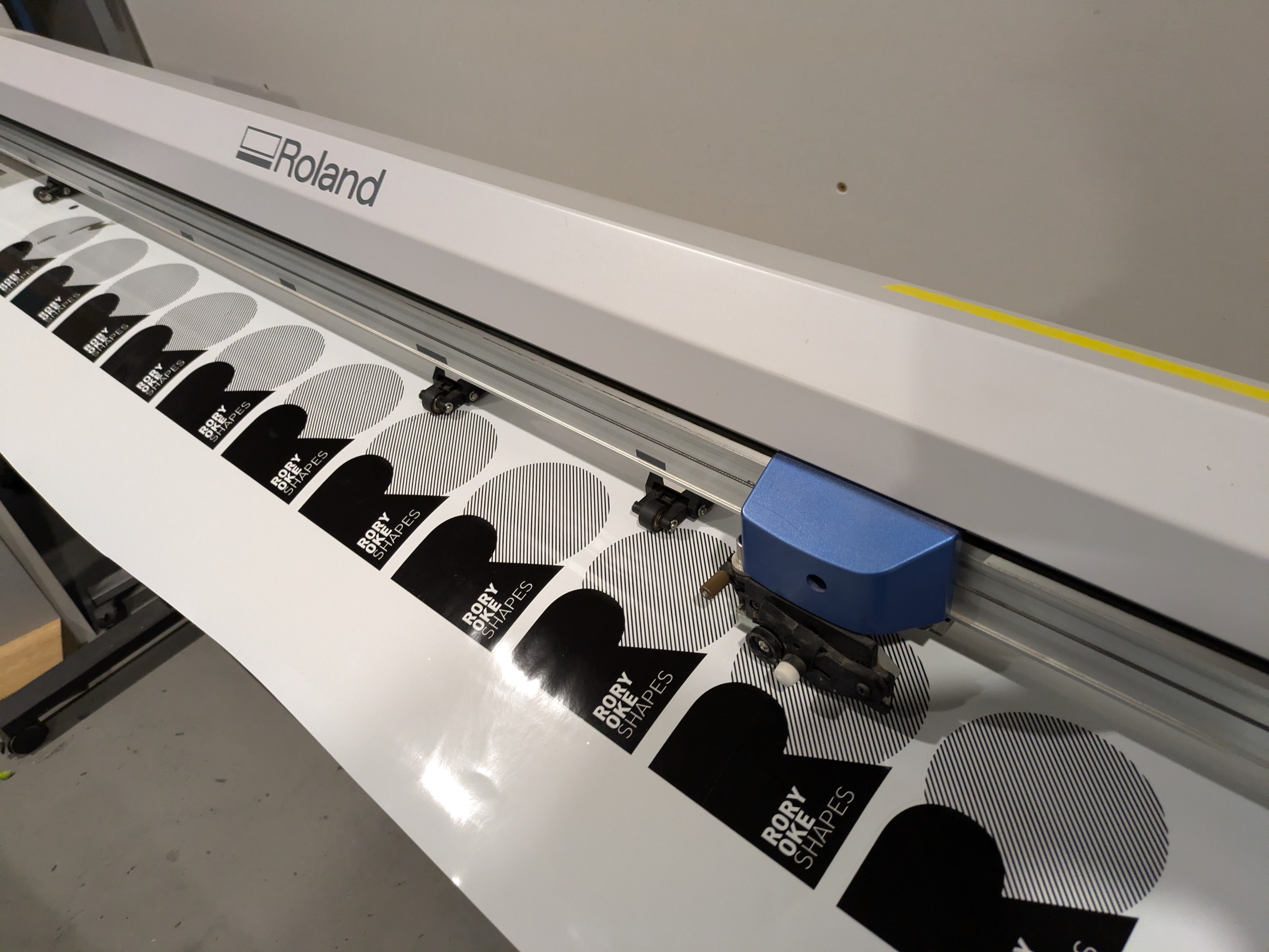 Our Roland digital printing machine printing stickers for Rory Oke Shapes from Oke Surfboards at the Saltwater Sign Co. factory
